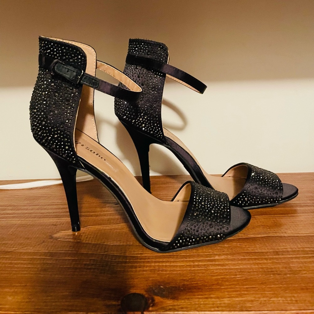 Black rhinestone stiletto heeled shoes by Zigi Soho